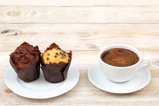 Savor the delightful experience of rich chocolate and creamy vanilla muffins along with a fresh cup of coffee
