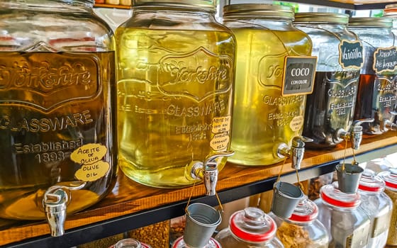 Organic store with self service oils and liquids in jars and bottles in Zicatela Puerto Escondido Oaxaca Mexico.
