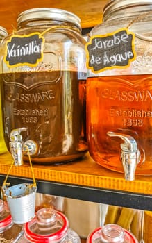 Organic store with self service oils and liquids in jars and bottles in Zicatela Puerto Escondido Oaxaca Mexico.