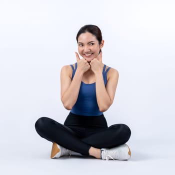 Full body asian woman in sportswear portrait, smiling and posing cheerful gesture. Workout training with attractive girl engage in her pursuit of healthy lifestyle. Isolated background Vigorous