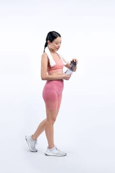 Athletic and sporty asian woman resting and drink water after intensive cardio workout training. Healthy exercising and fit body care lifestyle pursuit in studio shot isolated background. Vigorous