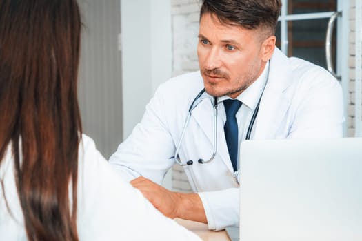 Doctor in professional uniform examining patient at hospital or medical clinic. Health care , medical and doctor staff service concept. Jivy