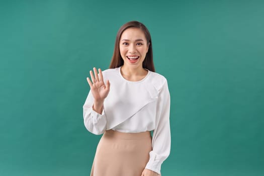 happy asian business woman waving her hand