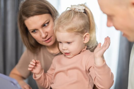 Cochlear implant on the girl head - hearing aid. Modern medicine technologies for deafness treatment.