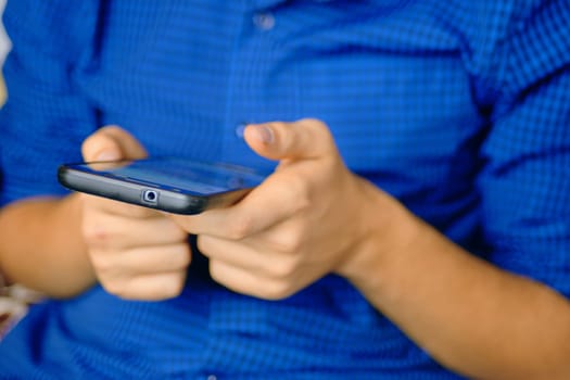 Using Smartphone. Close up of a human using mobile smart phone.