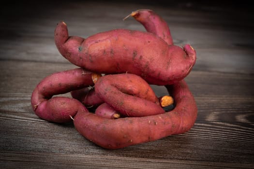 Sweet potatoes on the brown background, High quality photo