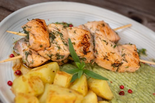 Barbecued salmon skewer with potatoes and broccoli Puree, High quality photo