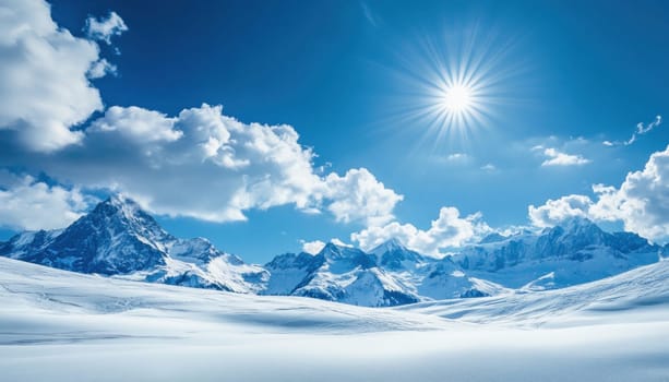 Beautiful winter landscape with snowy mountains and shining sun in a clear blue sky