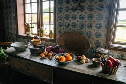 A cozy rustic kitchen featuring a wooden table adorned with fruits and vegetables. Natural light streams through the windows creating a warm, inviting atmosphere. Perfect for themes of home and simplicity