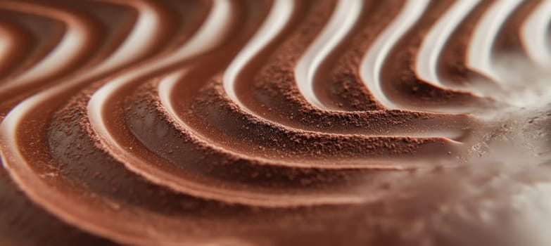 Close up of a milk chocolate bar surface forming a beautiful wavy pattern