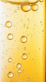 Golden liquid containing bubbles forming an abstract pattern, ideal for backgrounds and textures