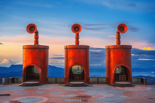 Futuristic metal buildings in steampunk style in Ba Na Hills Park in Da Nang in Vietnam at sunset