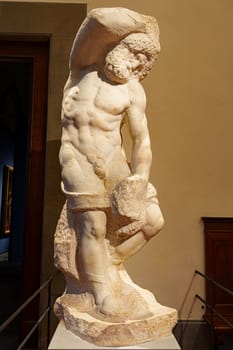 Florence, Italy, January 5, 2024: Bearded Slave. Michelangelo Buonarroti. Accademia Gallery