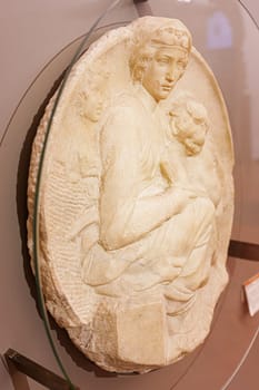 Florence, Italy, January 6, 2024: Tondo Pitti. Madonna and child with the young Saint John. Michelangelo. Bargello Museum
