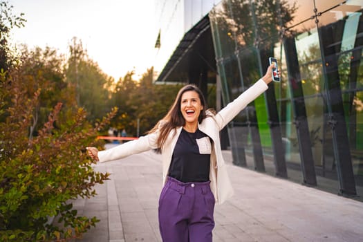 Smiling businesswoman feeling excited after finnshing work.