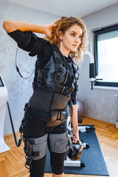 A woman engages in innovative fitness training with specialized equipment.
