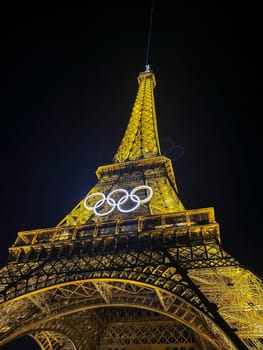 Paris, FRANCE - October 2024: The Olympic Rings installed on the Eiffel Tower ahead of the Paris 2024 Olympic Games, High quality photo