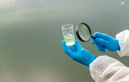 Take water samples for analysis. Selective focus. nature.