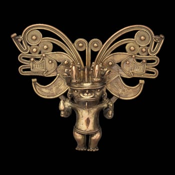 A Tairona gold figure pendant, a Pre-Columbian artifact depicting a stylized human figure with intricate motifs.
