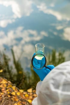 Take water samples for analysis. Selective focus. nature.