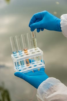 Take water samples for analysis. Selective focus. nature.