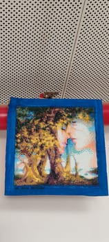 lovers, couple man and woman, love cross stitch on fabric, art picture. High quality photo