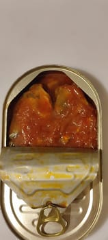 metal can fish in tomato sauce, isolated object, white background. High quality photo
