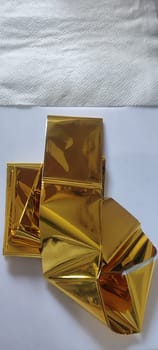 thin gold foil aluminum blanket background AliExpress souvenir texture, emergency blanket, abstract object on white background
