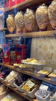 Italian pasta in fine glass containers. Gourmet Italian pasta. Typical Venetian pasta. Gastronomic tourism concep.Vertical real picture