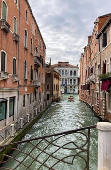 Colourful Venetian houses and narrow canals in Venezia,Italy. Wallpaper, background for tourism advertisements and brochures.Copy space .Real picture