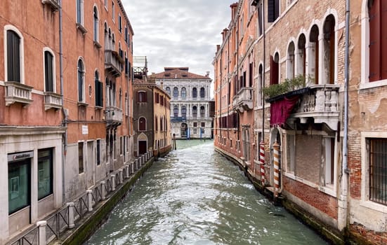 Horizontal real picture of narrow streets of Venice with old buildings. Wallpaper, background for tourism advertisements and brochures.Copy space .