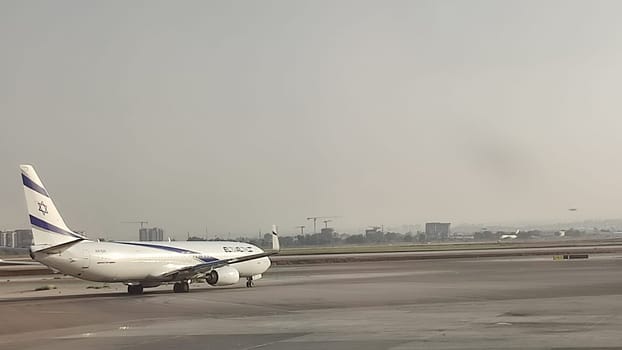 15 October 2024 Tel-Aviv Israel Ben Gurion airport, passenger plane Boeing airline El Al Israel Airlines, on the runway, travel transport, gray sky. High quality editorial photo