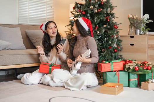 A young couple celebrates Christmas with a festive party, surrounded by decorations, gifts, and holiday cheer in a cozy home.