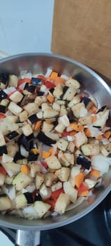 blue eggplant vegetables, carrots healthy food, frying pan plant fruit, vegetarian cooking. High quality photo
