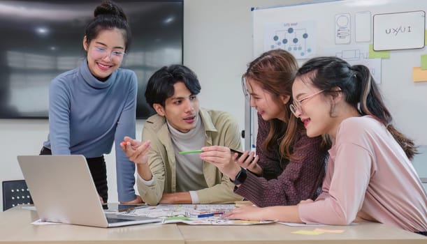 Asian office team brainstorming, plan for solution idea, Group of asian creative teamwork and woman leader at business meeting for developing mobile phone app, ux, ui start up, small business.