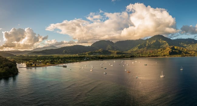 Aerial view of the bay and town of Hanalei with famous pier as the sun rises over the wildlife refuge