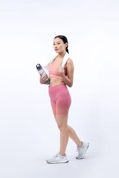 Athletic and sporty asian woman resting and drink water after intensive cardio workout training. Healthy exercising and fit body care lifestyle pursuit in studio shot isolated background. Vigorous