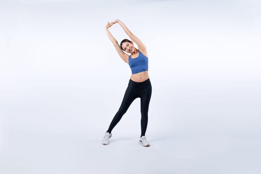 Full body asian woman in sportswear portrait, smiling and posing cheerful gesture. Workout training with attractive girl engage in her pursuit of healthy lifestyle. Isolated background Vigorous