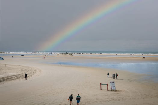 romo,denmark,11-09-2024:romo, one of the wadden islands where you can drive a car on the beach, enjoy the beach and the sea with a rainbow