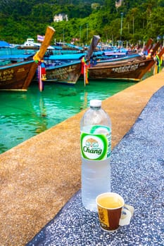 Thai longtail boats chang water and coffee on Koh Phi Phi Don island in Ao Nang Amphoe Mueang Krabi Thailand in Southeast Asia.