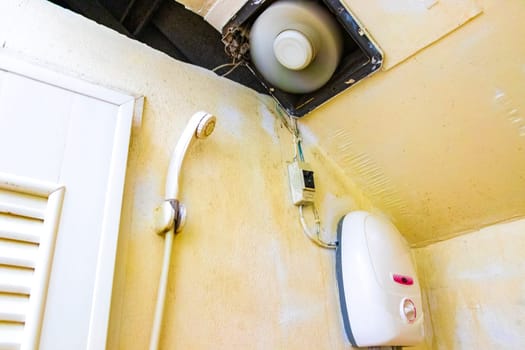 Cheap and dirty hotel room toilet on Koh Phi Phi Don island in Ao Nang Amphoe Mueang Krabi Thailand in Southeast Asia.