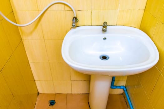 Cheap and dirty hotel room toilet on Koh Phi Phi Don island in Ao Nang Amphoe Mueang Krabi Thailand in Southeast Asia.