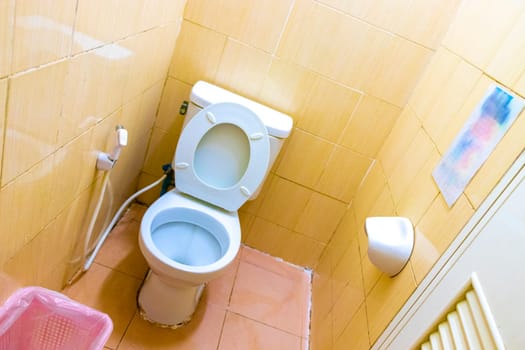 Cheap and dirty hotel room toilet on Koh Phi Phi Don island in Ao Nang Amphoe Mueang Krabi Thailand in Southeast Asia.