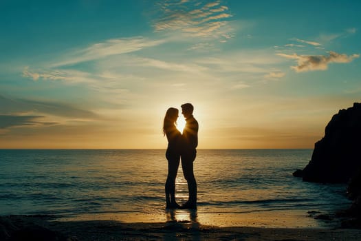 A beautiful silhouette of a couple hugging each other, enjoying intimacy and making love at a beach during sunset..