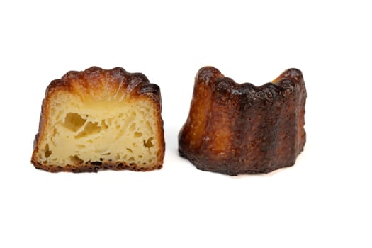 Caneles de bordeaux, traditional French sweet dessert with white table background, High quality photo