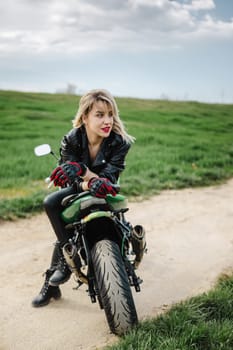 Woman in Leather Outfit Sitting on Motorcycle. Confident woman in leather pants and jacket sitting on a motorcycle. Ideal for themes of adventure, fashion, or biker lifestyle. Captures a bold.