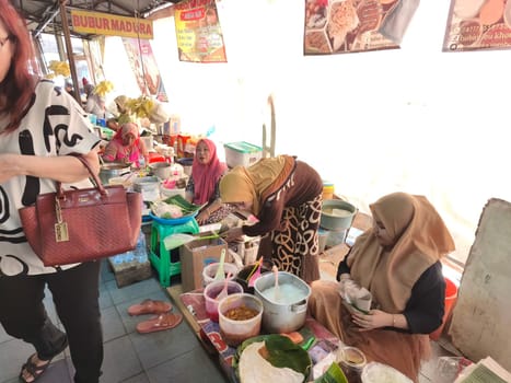 November 2, 2024. Surabaya, Indonesia. Savor authentic Madura delicacies at Pasar Atom. Our stall offers a delightful array of traditional treats, from savory snacks to sweet desserts. Taste the rich flavors of Madura, right in the heart of Surabaya.