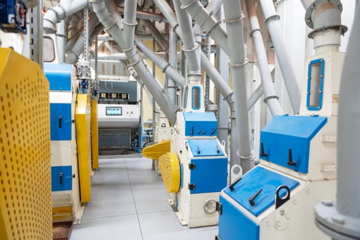 Roller deck machines for husking buckwheat grain, operating in a modern processing facility.