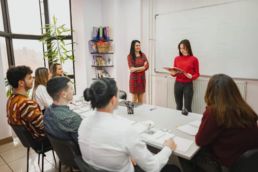 Female student doing a presentation at language school.