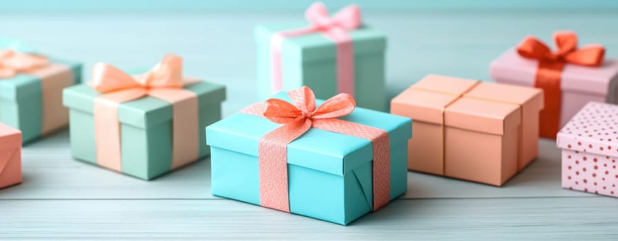 Colorful gift boxes arranged creatively on wooden surface, showcasing various designs and ribbons. Perfect for celebrations and special occasions.